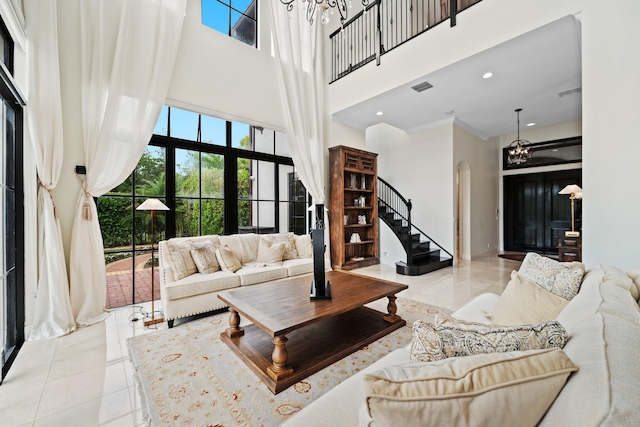 9650 Eden Mnr, Parkland, FL 33076 - tiled living area with an inviting chandelier, arched walkways, a towering ceiling, and a healthy amount of sunlight