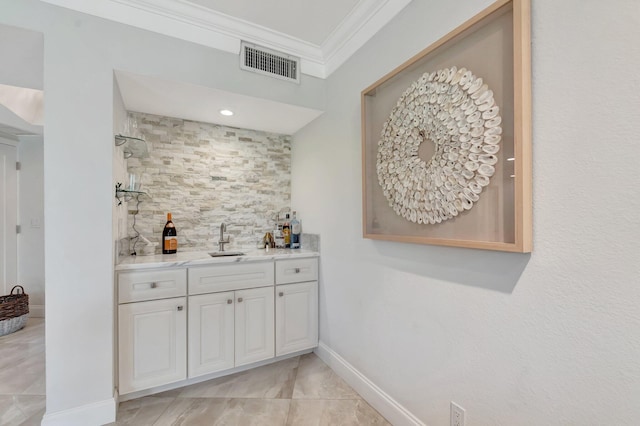 5279 Fountains Dr S Unit 304, Lake Worth, FL 33467 - indoor wet bar featuring ornamental molding, tasteful backsplash, and baseboards