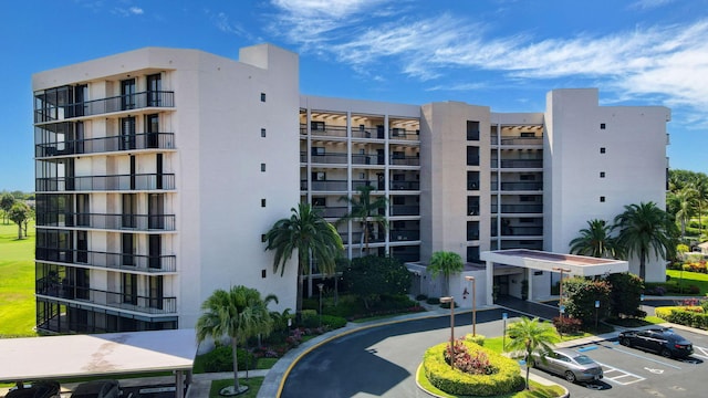 5279 Fountains Dr S Unit 304, Lake Worth, FL 33467 - view of apartment building / complex featuring uncovered parking