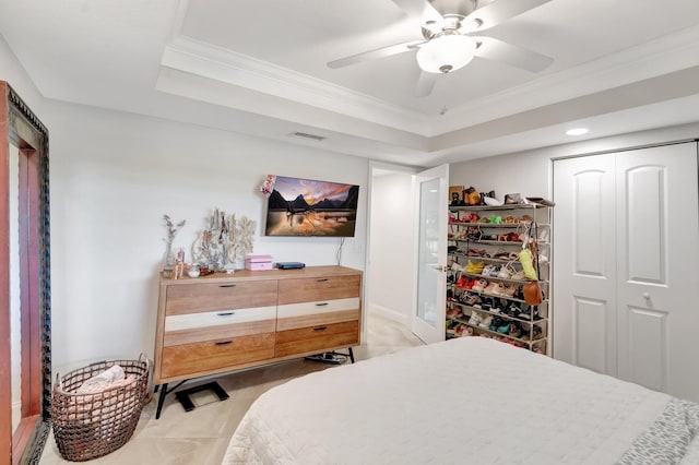 5279 Fountains Dr S Unit 304, Lake Worth, FL 33467 - bedroom with a tray ceiling, a closet, crown molding, and a ceiling fan