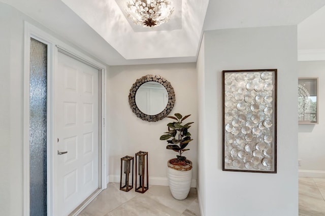 5279 Fountains Dr S Unit 304, Lake Worth, FL 33467 - foyer featuring a chandelier and baseboards