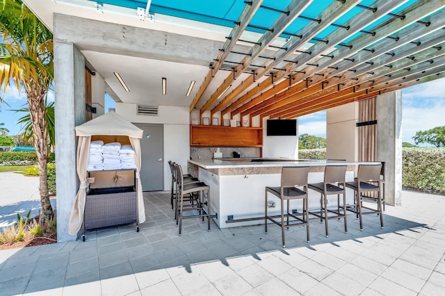 5279 Fountains Dr S Unit 304, Lake Worth, FL 33467 - view of patio featuring exterior kitchen