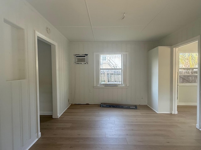 523 48th St, West Palm Beach, FL 33407 - unfurnished dining area featuring wood finished floors and a wall mounted AC