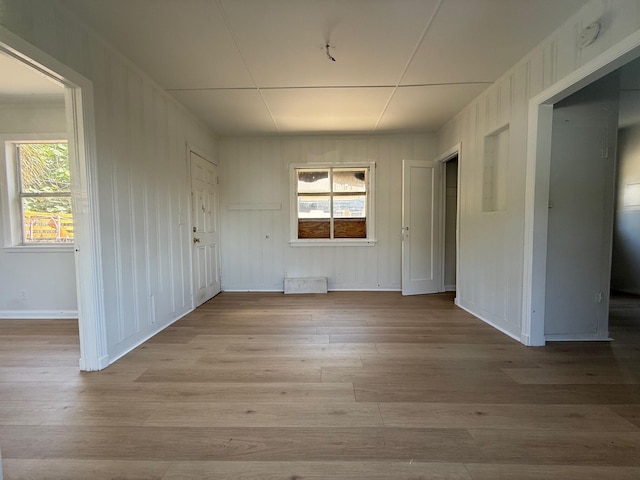 523 48th St, West Palm Beach, FL 33407 - unfurnished dining area featuring wood finished floors, baseboards, and healthy amount of natural light