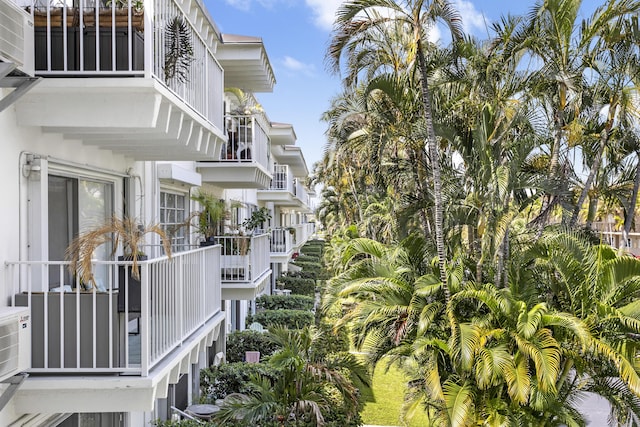 view of side of property with a balcony