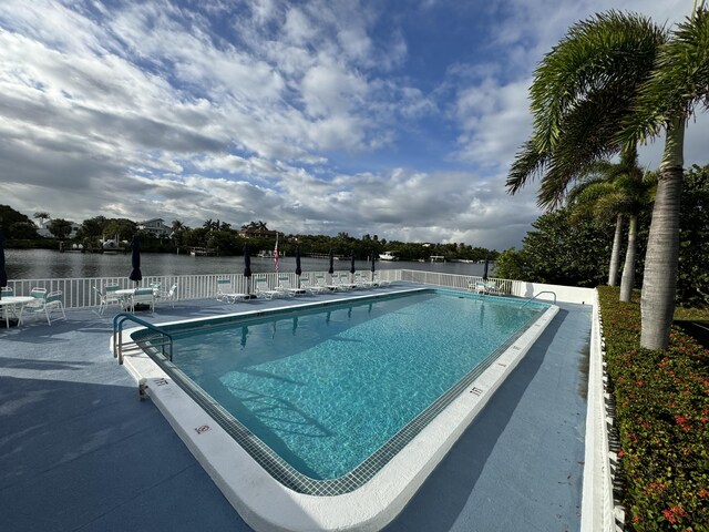 4001 S Ocean Blvd Unit 218, South Palm Beach, FL 33480 - community pool with a patio area and a water view