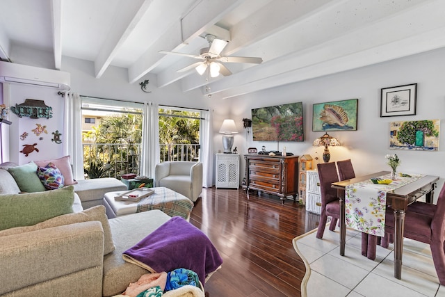 living room with wood finished floors, a ceiling fan, a wall mounted AC, and beam ceiling