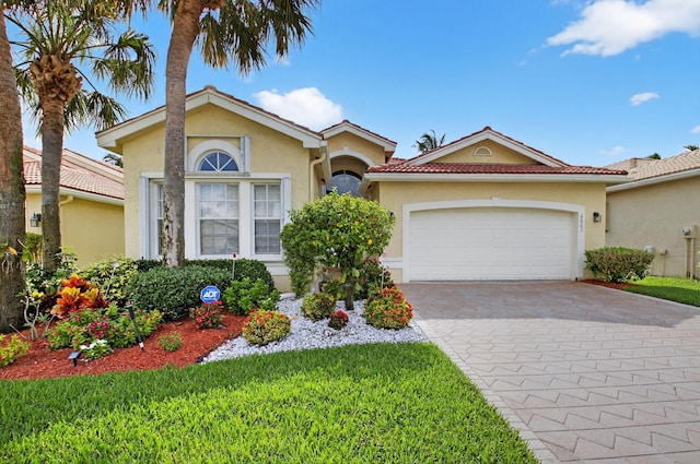 6863 Imperial Beach Cir, Delray Beach, FL 33446 - mediterranean / spanish home with stucco siding, decorative driveway, a front yard, and an attached garage
