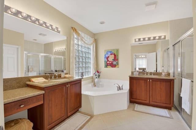 6863 Imperial Beach Cir, Delray Beach, FL 33446 - full bathroom featuring a stall shower, two vanities, a garden tub, and tile patterned floors