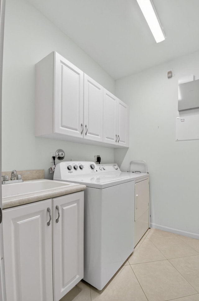 6863 Imperial Beach Cir, Delray Beach, FL 33446 - laundry room with cabinet space, washing machine and dryer, baseboards, and light tile patterned floors