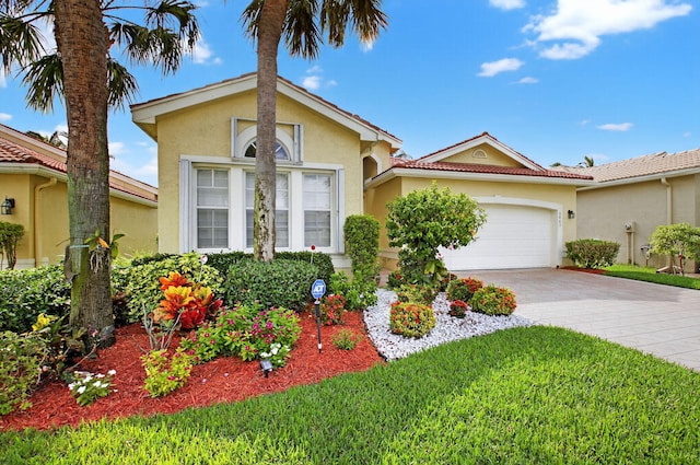 6863 Imperial Beach Cir, Delray Beach, FL 33446 - view of front of home featuring stucco siding, an attached garage, driveway, and a front yard