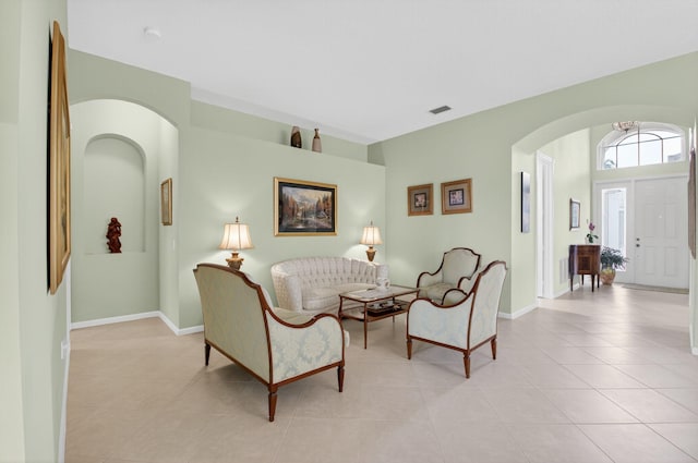 6863 Imperial Beach Cir, Delray Beach, FL 33446 - living area featuring arched walkways, light tile patterned floors, and baseboards