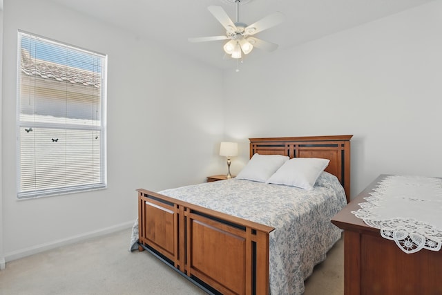 477 NW Blue Lake Dr, Port Saint Lucie, FL 34986 - bedroom with light colored carpet, baseboards, and ceiling fan