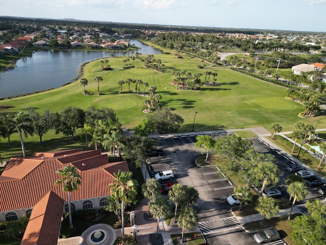 477 NW Blue Lake Dr, Port Saint Lucie, FL 34986 - aerial perspective of suburban area with a nearby body of water and a golf course