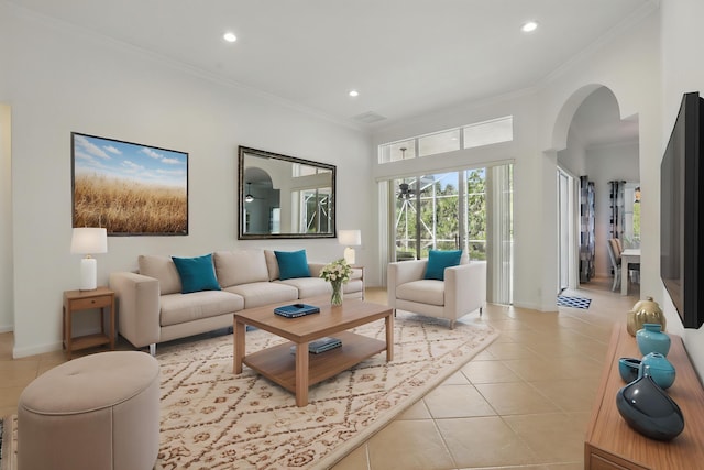 477 NW Blue Lake Dr, Port Saint Lucie, FL 34986 - living area featuring arched walkways, recessed lighting, light tile patterned floors, ornamental molding, and baseboards