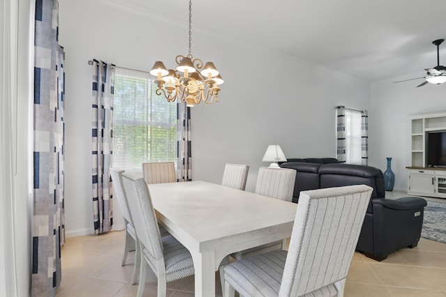 477 NW Blue Lake Dr, Port Saint Lucie, FL 34986 - dining room with a chandelier, light tile patterned flooring, and a ceiling fan