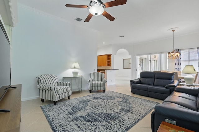 477 NW Blue Lake Dr, Port Saint Lucie, FL 34986 - living room with light tile patterned floors, a chandelier, a ceiling fan, crown molding, and baseboards