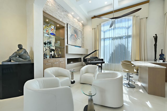 sitting room featuring arched walkways and recessed lighting
