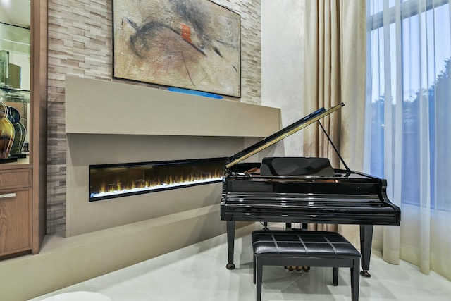 living area with a glass covered fireplace