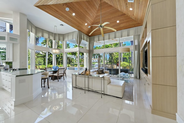 living area featuring wooden ceiling, light tile patterned floors, and recessed lighting