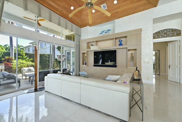 tiled living area featuring a towering ceiling, recessed lighting, a ceiling fan, visible vents, and wooden ceiling