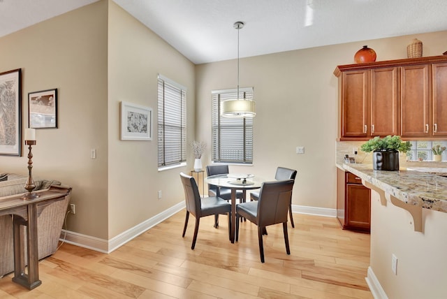 9380 Isles Cay Dr, Delray Beach, FL 33446 - dining space with light wood finished floors and baseboards
