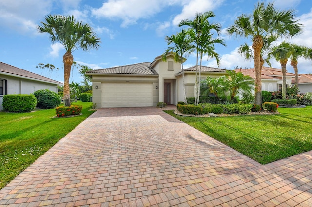 9380 Isles Cay Dr, Delray Beach, FL 33446 - view of front of house featuring stucco siding, a garage, decorative driveway, a front yard, and a tiled roof