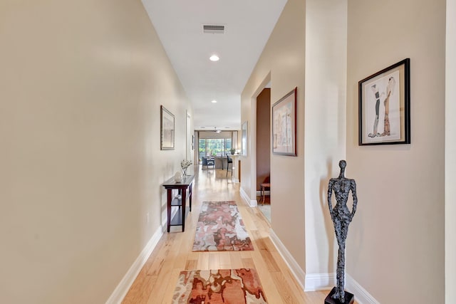 9380 Isles Cay Dr, Delray Beach, FL 33446 - hall with light wood finished floors, baseboards, and recessed lighting