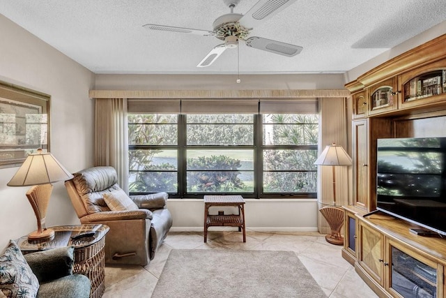 9 Plantation Dr Unit 104, Vero Beach, FL 32966 - interior space with a textured ceiling, ceiling fan, and plenty of natural light