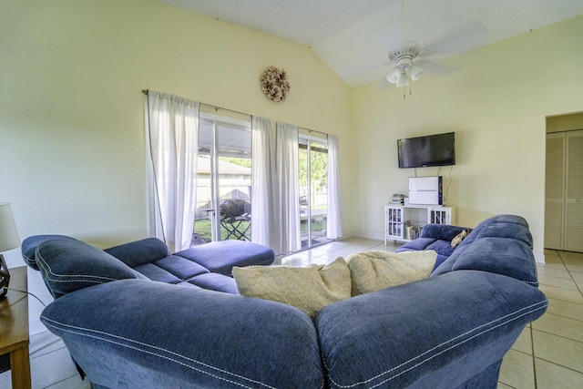 living room featuring ceiling fan, tile patterned floors, and vaulted ceiling