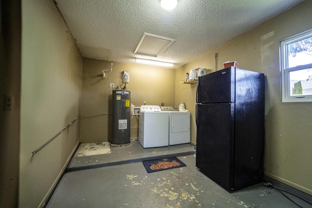 laundry area featuring laundry area, a textured ceiling, attic access, washer and clothes dryer, and electric water heater