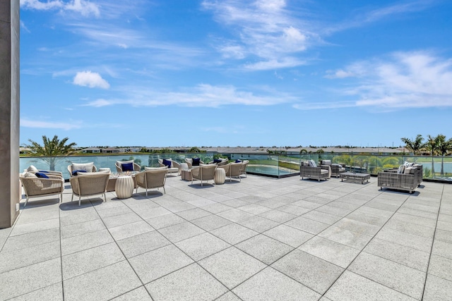 view of patio / terrace featuring outdoor lounge area and a water view