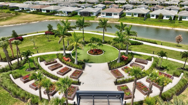 drone / aerial view featuring a residential view and a water view