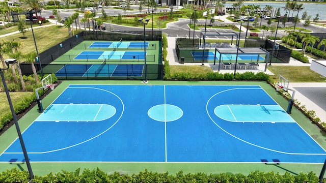 view of sport court featuring fence