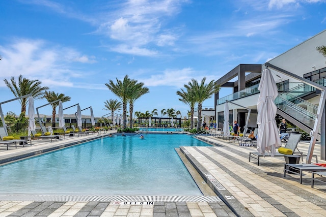 community pool with a patio area