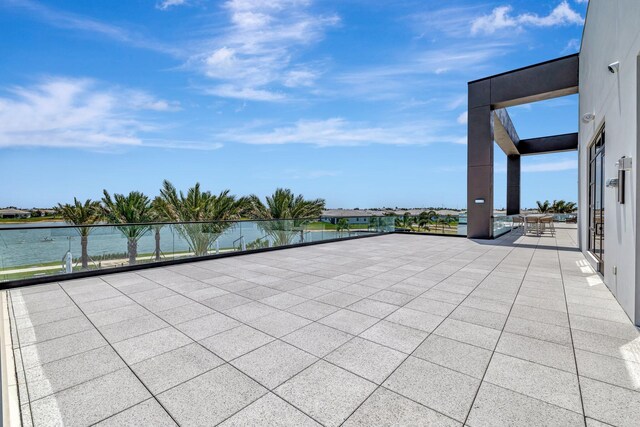 view of patio with a water view