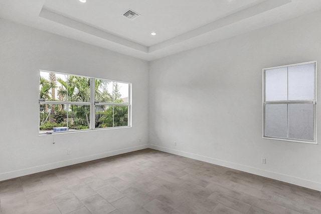 10130 Driftwood Way, Palm Beach Gardens, FL 33412 - spare room with a raised ceiling, baseboards, and recessed lighting