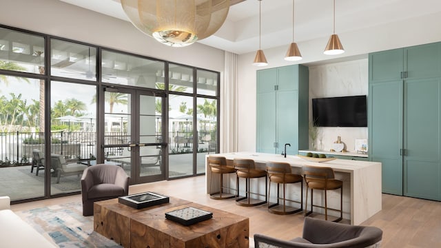10130 Driftwood Way, Palm Beach Gardens, FL 33412 - living room featuring light wood-style floors and french doors