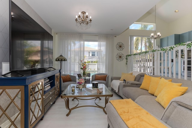 living room featuring a chandelier and light wood finished floors