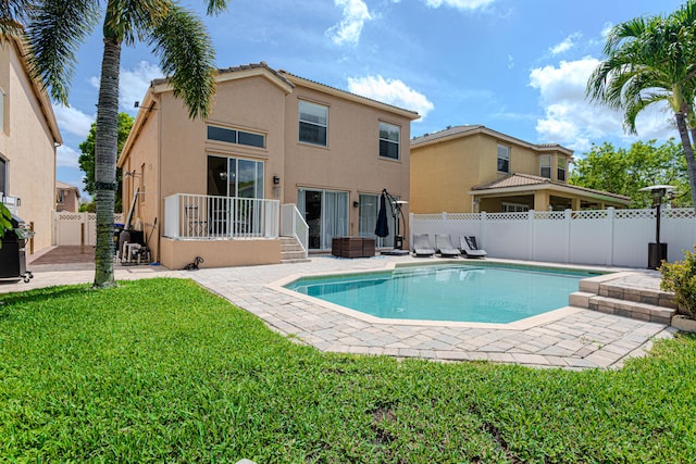 back of property featuring stucco siding and a patio area