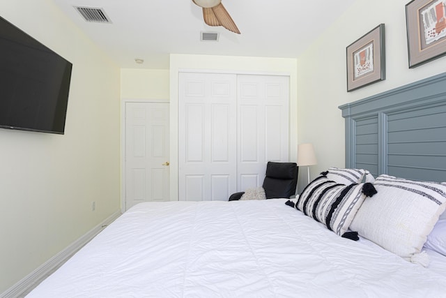 bedroom featuring a closet, baseboards, and a ceiling fan