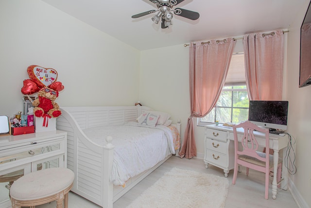 bedroom featuring baseboards and a ceiling fan