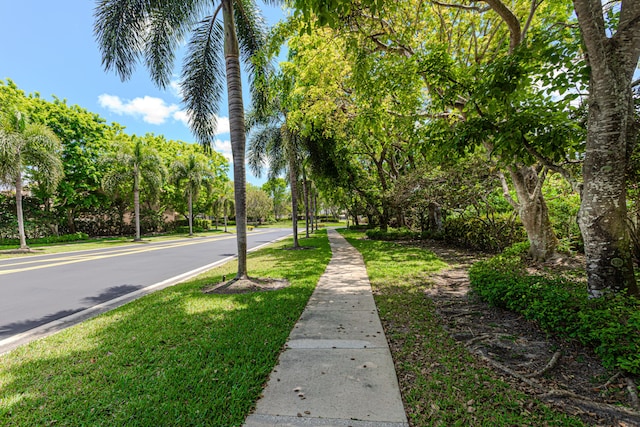 view of asphalt street with sidewalks