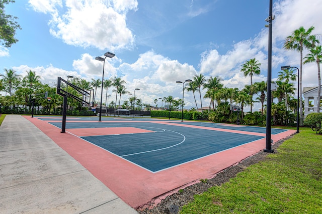 view of basketball court featuring community basketball court and fence