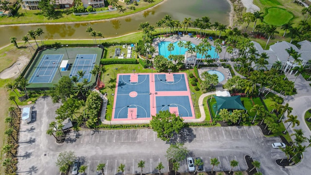 drone / aerial view of a large body of water and a pool