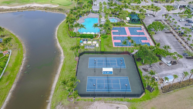 bird's eye view of a pool and a large body of water