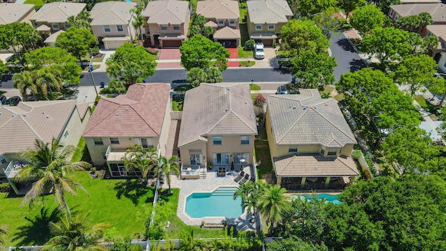 aerial view of residential area featuring a pool area