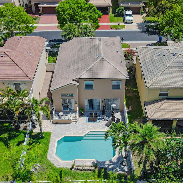 aerial view of property and surrounding area with a pool