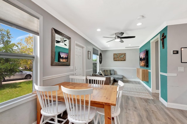 850 Green St, West Palm Beach, FL 33405 - dining area featuring light wood-style floors, crown molding, baseboards, and ceiling fan