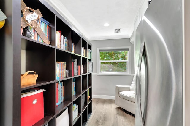 850 Green St, West Palm Beach, FL 33405 - living area with baseboards, ornamental molding, wood finished floors, and visible vents